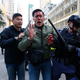 A rioter is taken away by police on a street in Mong Kok.